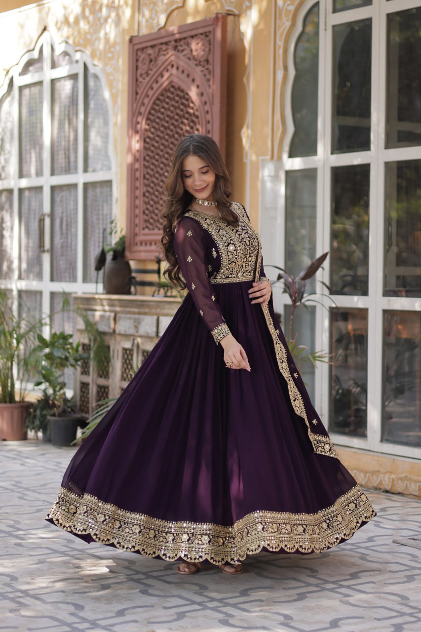 Women's Luxurious Plum Velvet Anarkali Gown with Heavy Gold Zari & Sequin Embroidery – Perfect for Weddings & Grand Festivities