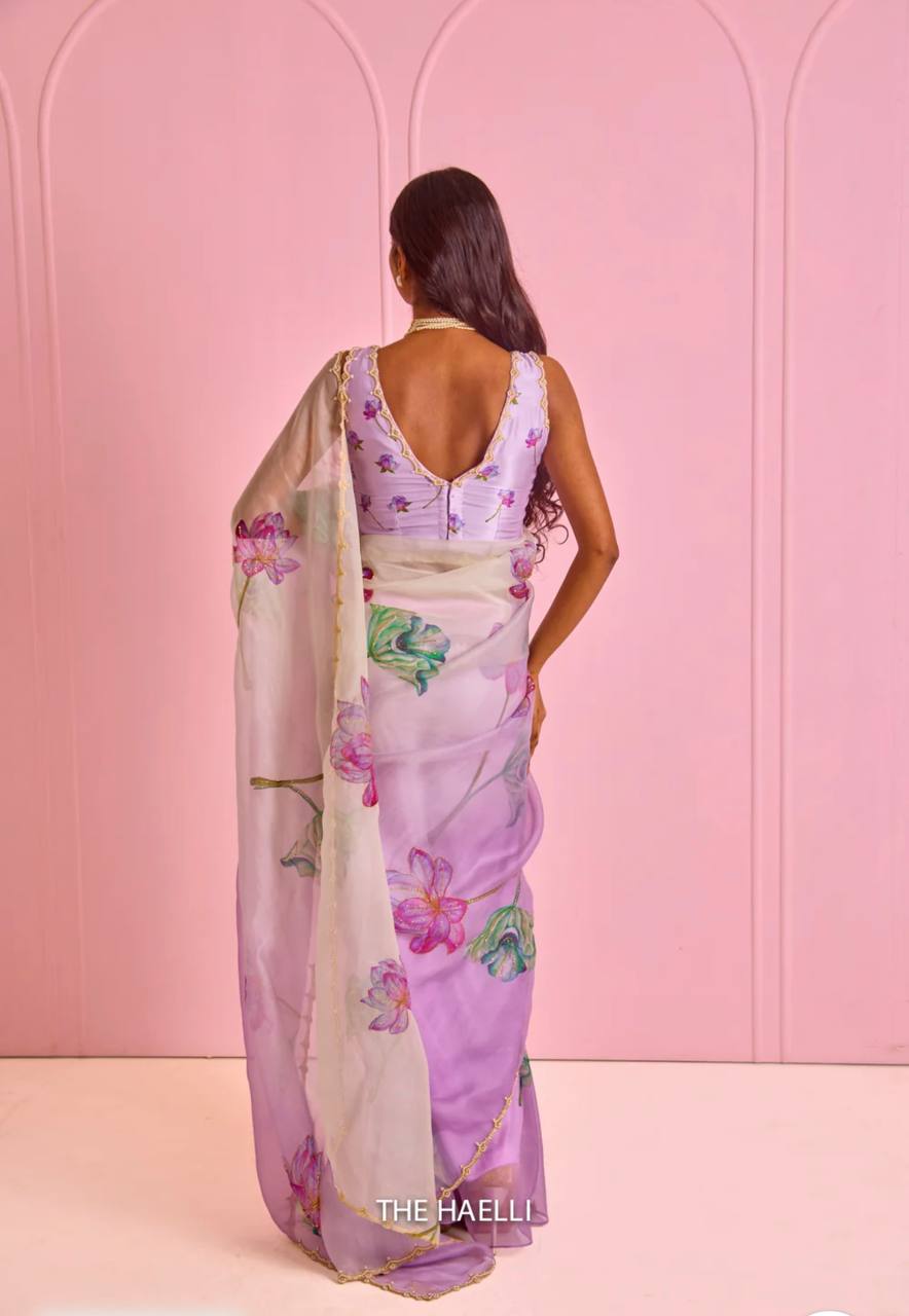Women's Exquisite Lavender & White Organza Saree with Hand-Painted Lotus Floral Motifs & Gold Embellished Border – Complete with Matching Printed Blouse for Festive & Special Occasions
