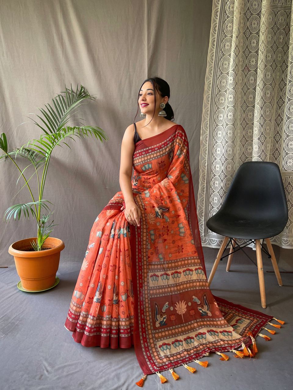 Women's Artistic Terracotta Orange Linen Saree with Kalamkari Inspired Print & Tassel Detailing – Perfect for Casual Festivities & Cultural Events
